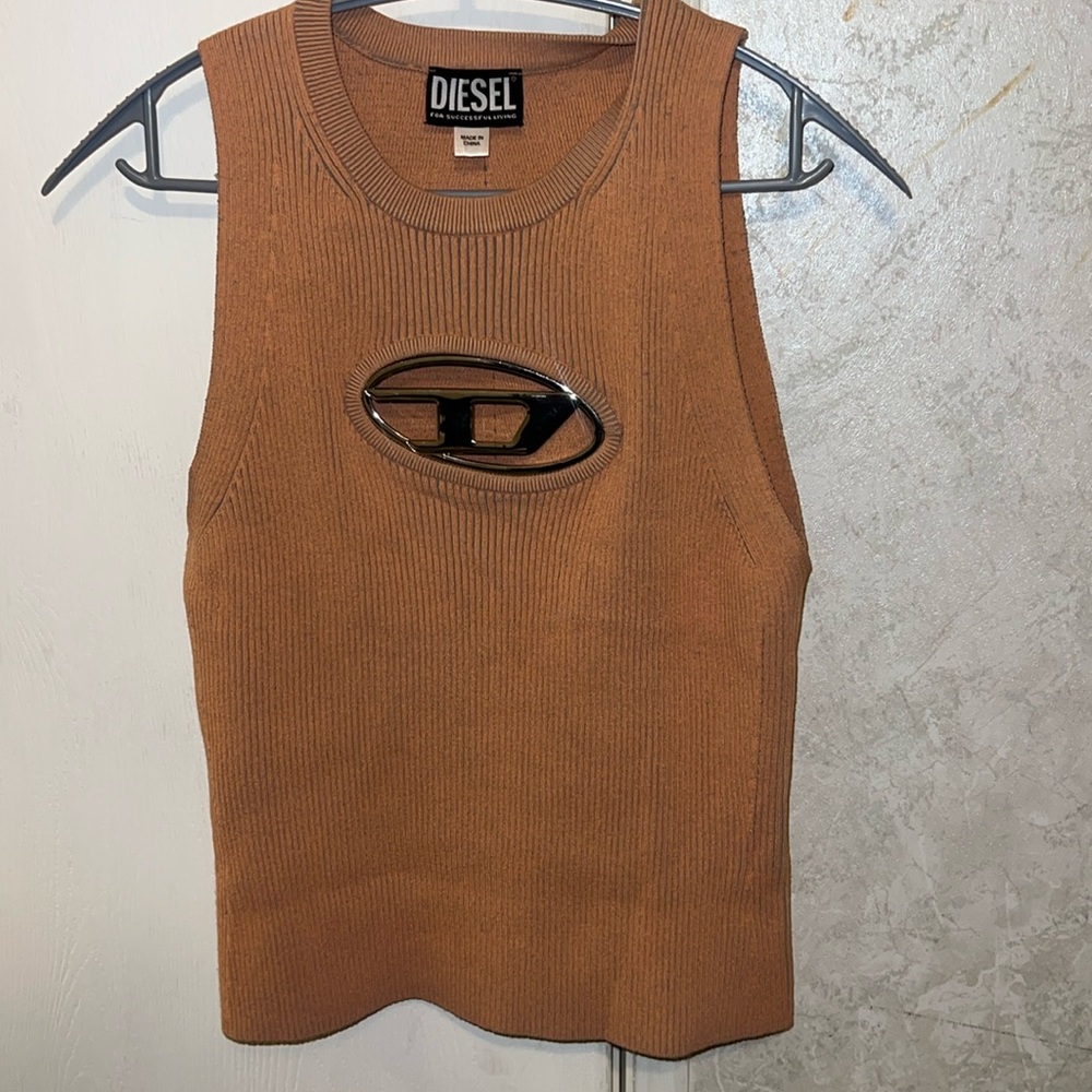 Diesel top in pink. Rarely worn. Paid 300 for it only asking for 200.